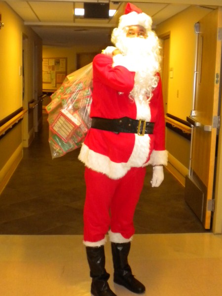 Photo of Bill Pelrine playing Santa Claus at Ellis Hospital 2011