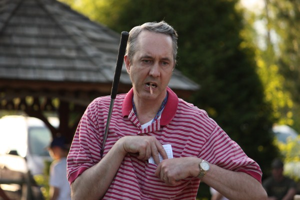 Photo of Bill Pelrine playing mini-golf